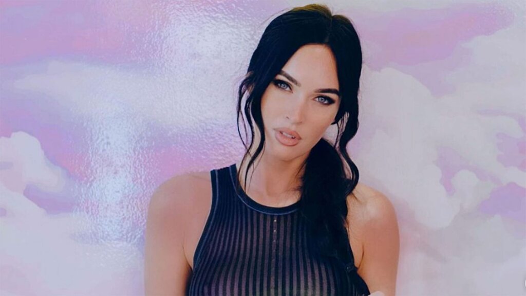 Sheer mesh tank top layered over bralette