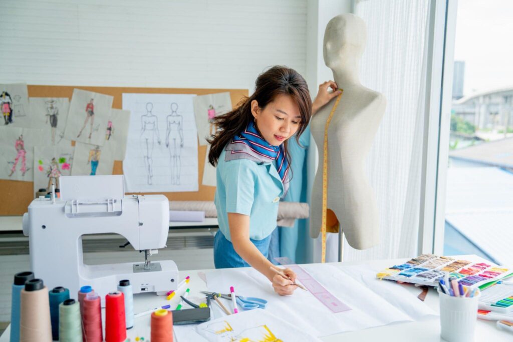 Designer supervising garment production line